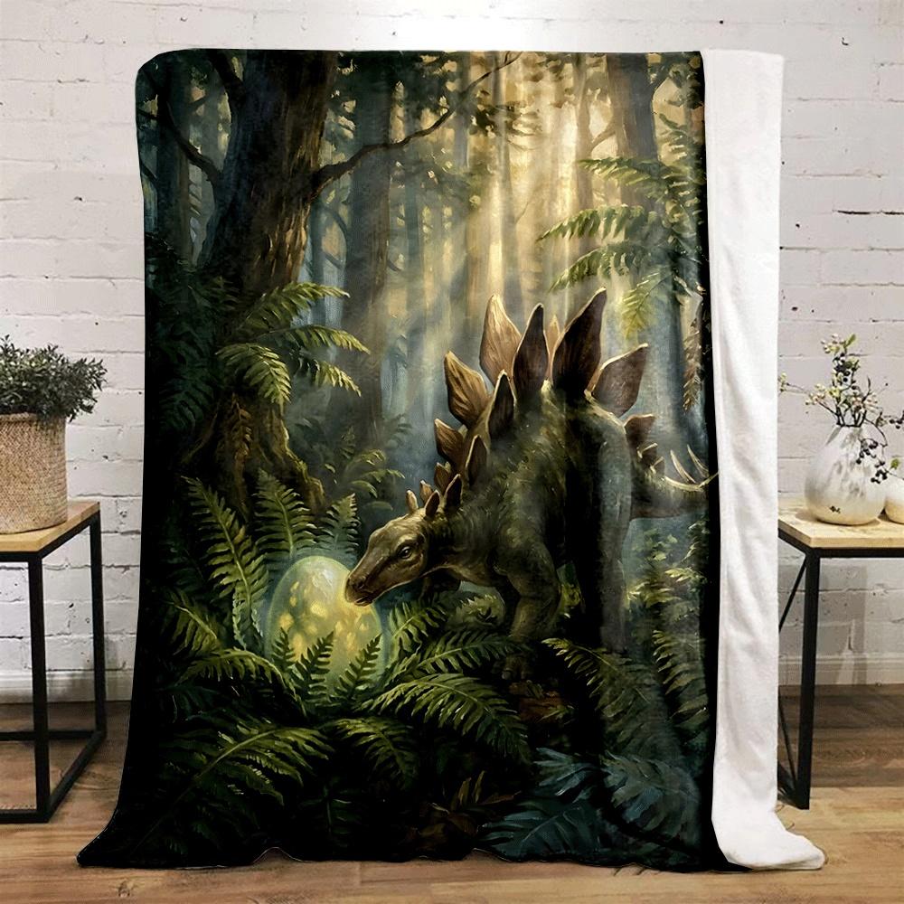 A Stegosaurus In a Lush Forest Examines a Glowing Egg Among Ferns. for All Seasons Blanket Lunch Break Throw Gift