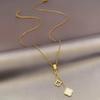 Copper-Plated Gold Four-Leaf Clover Tassel Pendant Necklace - Elegant, Minimalist, and Luxurious.