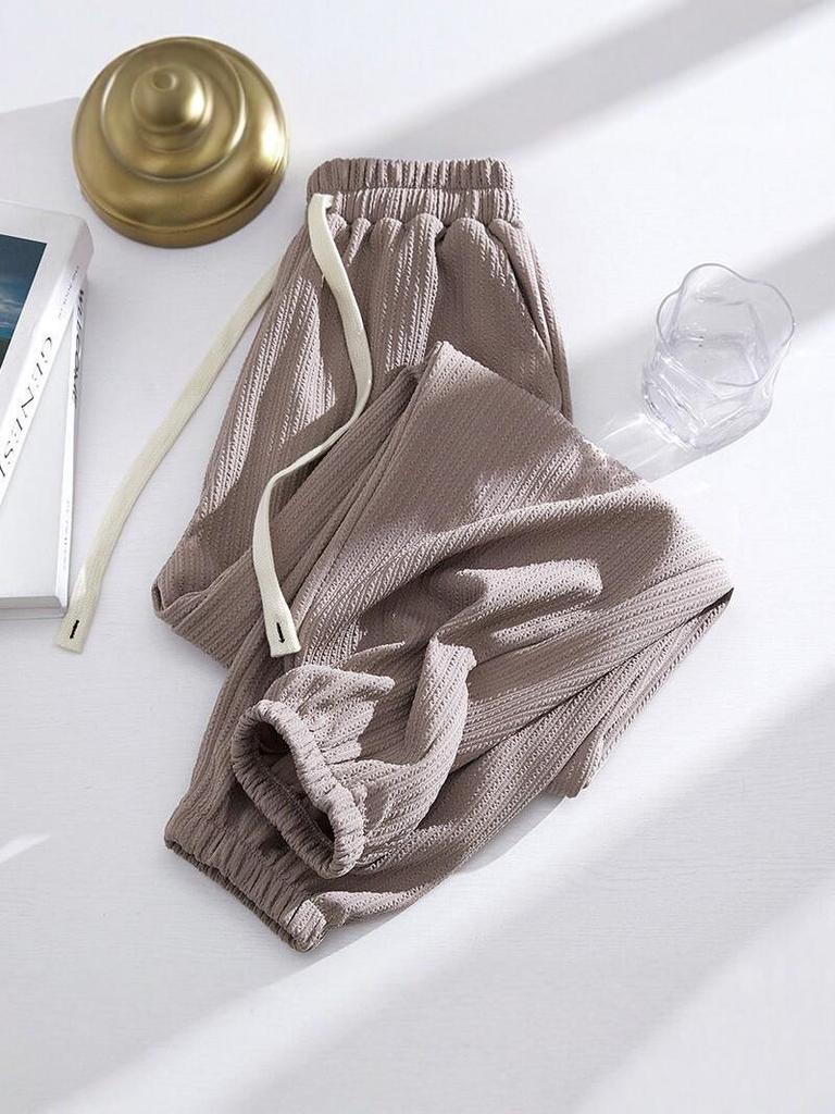 2026 Spring Slimming Joggers: Unisex Polyester Pants for Shorter Frames - Fashionable, Loose-Fit Harem Style for Spring/Autumn.
