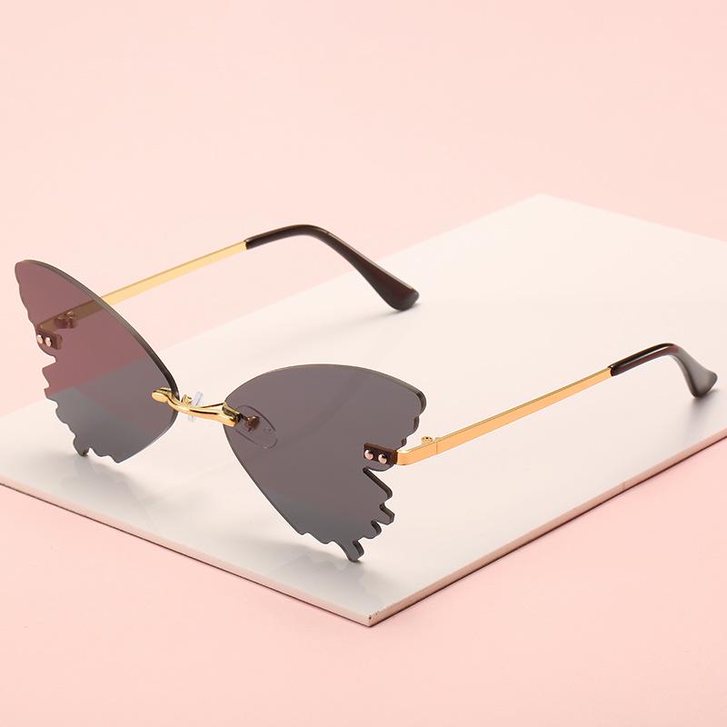 Women's personalized rimless sunglasses, European and American fashion butterfly glasses street show sunglasses rimless women
