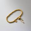 New Style Light Luxury Red Rope Titanium Steel Bracelet with Gold Coin for Women - Wealth Attraction and Festive Elegance by Xiyin