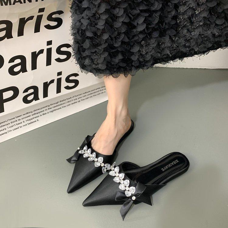 Baotou half slippers women's rhinestone bow wear 2025 new fairy wind pointed head shallow mouth flat-soled muller shoes
