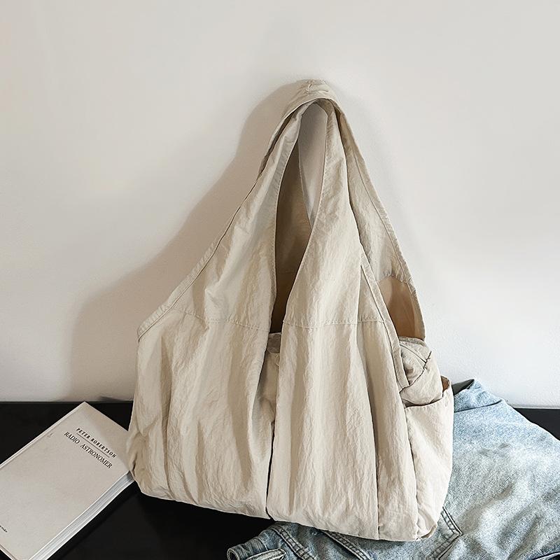 Neue Damen-Tragetasche mit mehreren Taschen, schlichtes und Nischen-Design, großes Fassungsvermögen, hochwertiges Gefühl, modisch, zum Tragen in der Hand, Schulter