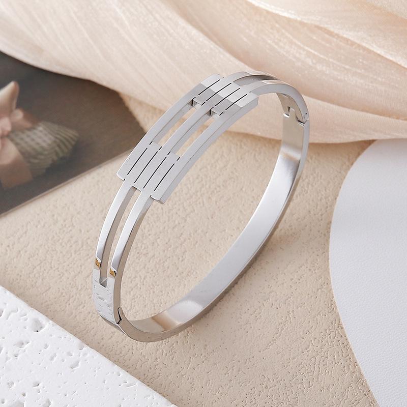 Sweet Cool Rhinestone Inlaid Titanium Steel Hollow Bracelet