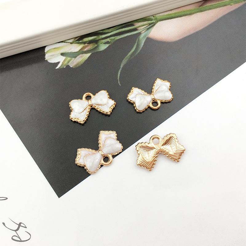 

Набор из 60 штук шармов в виде бантиков с капельной эмалью для изготовления украшений своими руками Drip oil + zinc alloy