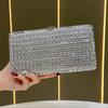 Lady Holding A Fashionable Evening Bag. Designer Water Droplet Chain Handbag for Ladies. Shoulder Bag for Ladies. Casually