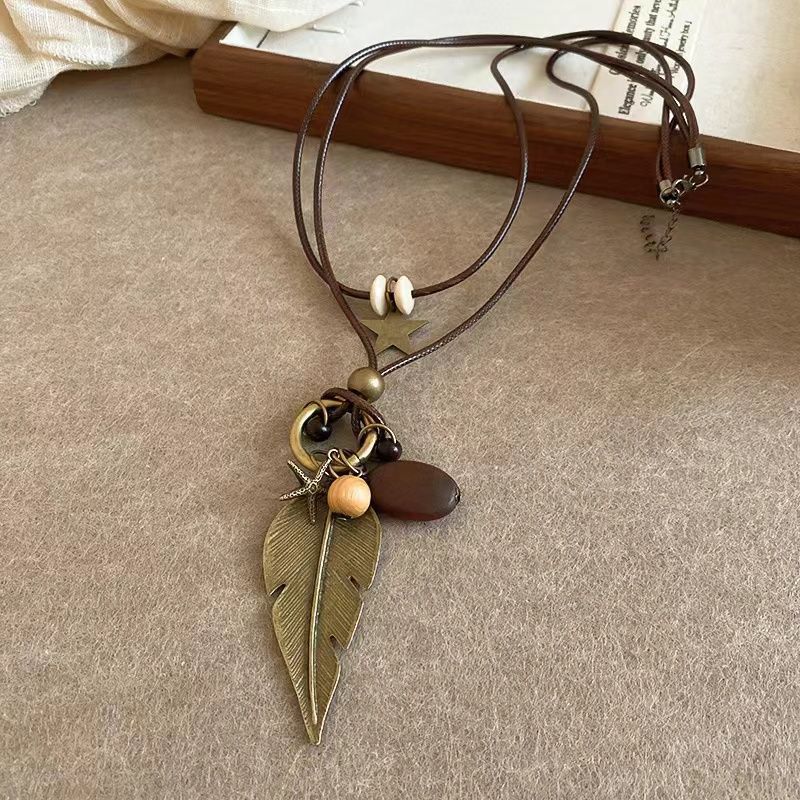 Zen-inspired Long Feather Necklace for Women, Featuring A Retro Ethnic Style and Multiple Layers of Sweater Chains, New Design.