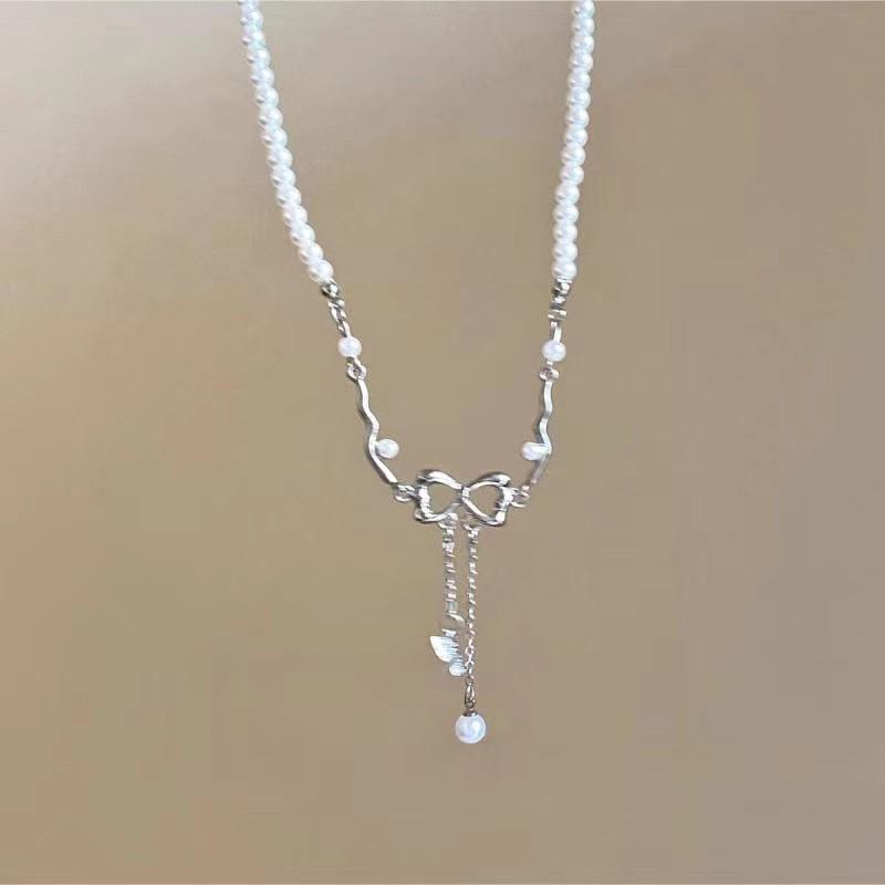 Hollow Bow Tassel Pearl Necklace for Women - Luxury Niche Design Clavicle Chain, 2025
