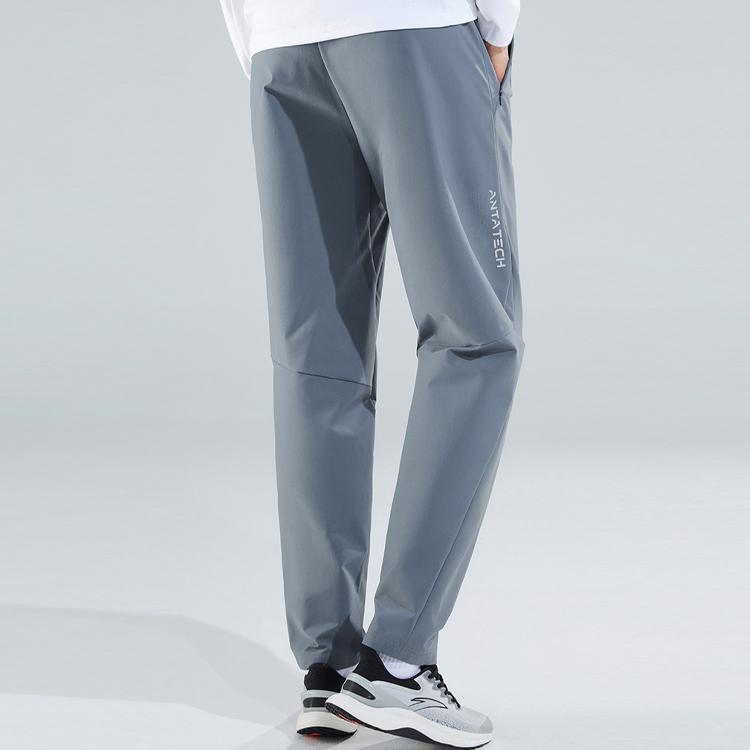 Anta Training Series Solid Color Logo Waterproof Oil Resistant Straight Leg Knitted Sports Pants Men Pants Snow-Rock-Gray 952317501-1
