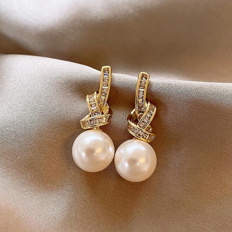 

Silver needle zircon knotted pearl pendant earrings retro court temperament earrings light luxury high-end earrings