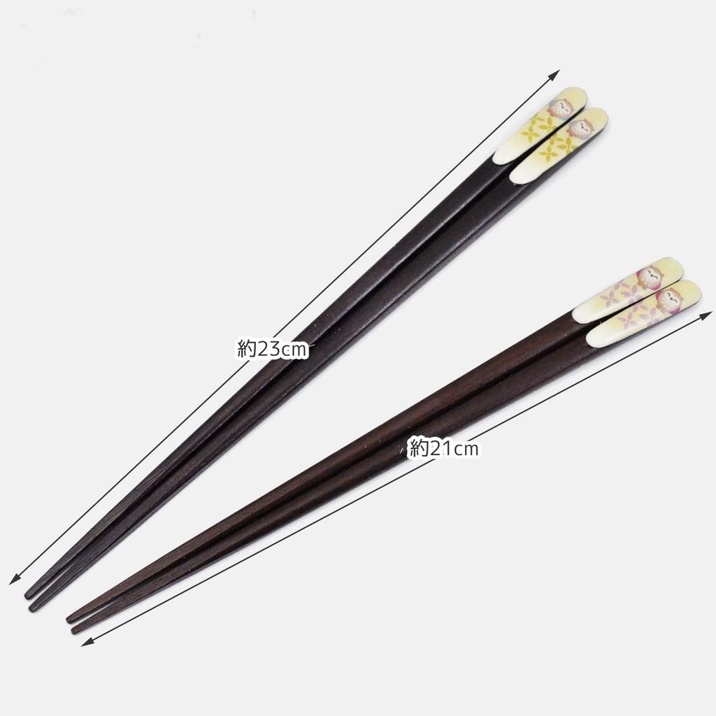A pair of lacquered chopsticks for featuring a lucky charm design and a smiling owl presented in a paulownia wood Made in couples, motif, box. Japan.