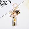 Talos Black Series Keychain Pendant, Dried Flower Initial Letter Charm Key Chain with Bee Tassel Design, A-Z Holder for Bag Purse Backpack
