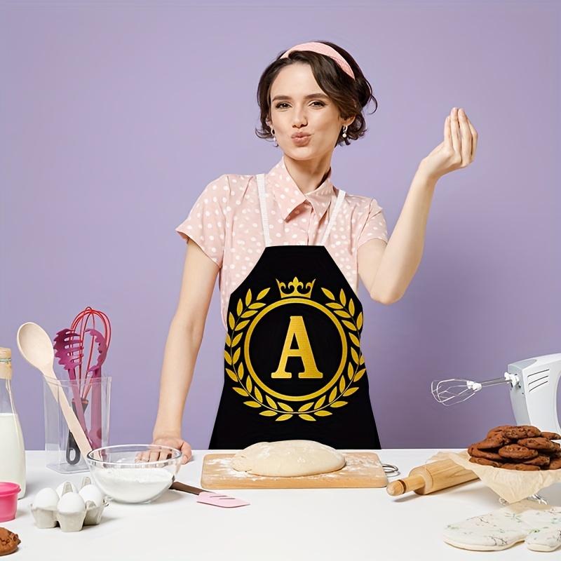 1 personalized letter apron with golden crown print on a black background, suitable for kitchen baking and barbecue