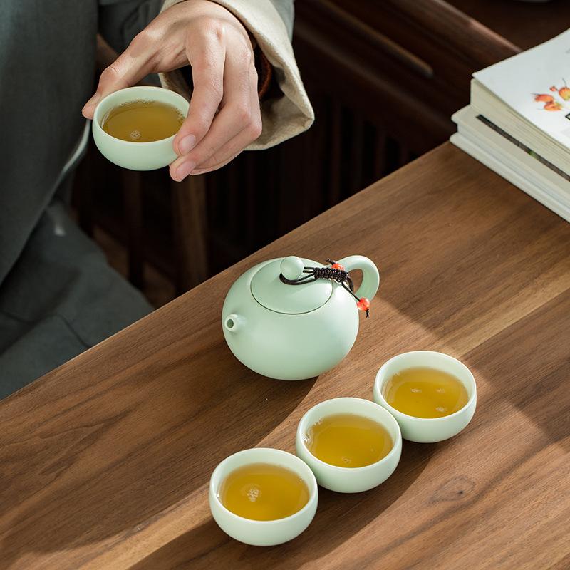 Ding Ofen Tragetasche Reise Kung-Fu Tee-Set Keramik Xishi Kanne Ein-Kannen-Zwei-Tassen-Vier-Tassen-Set Kreative Geschenke