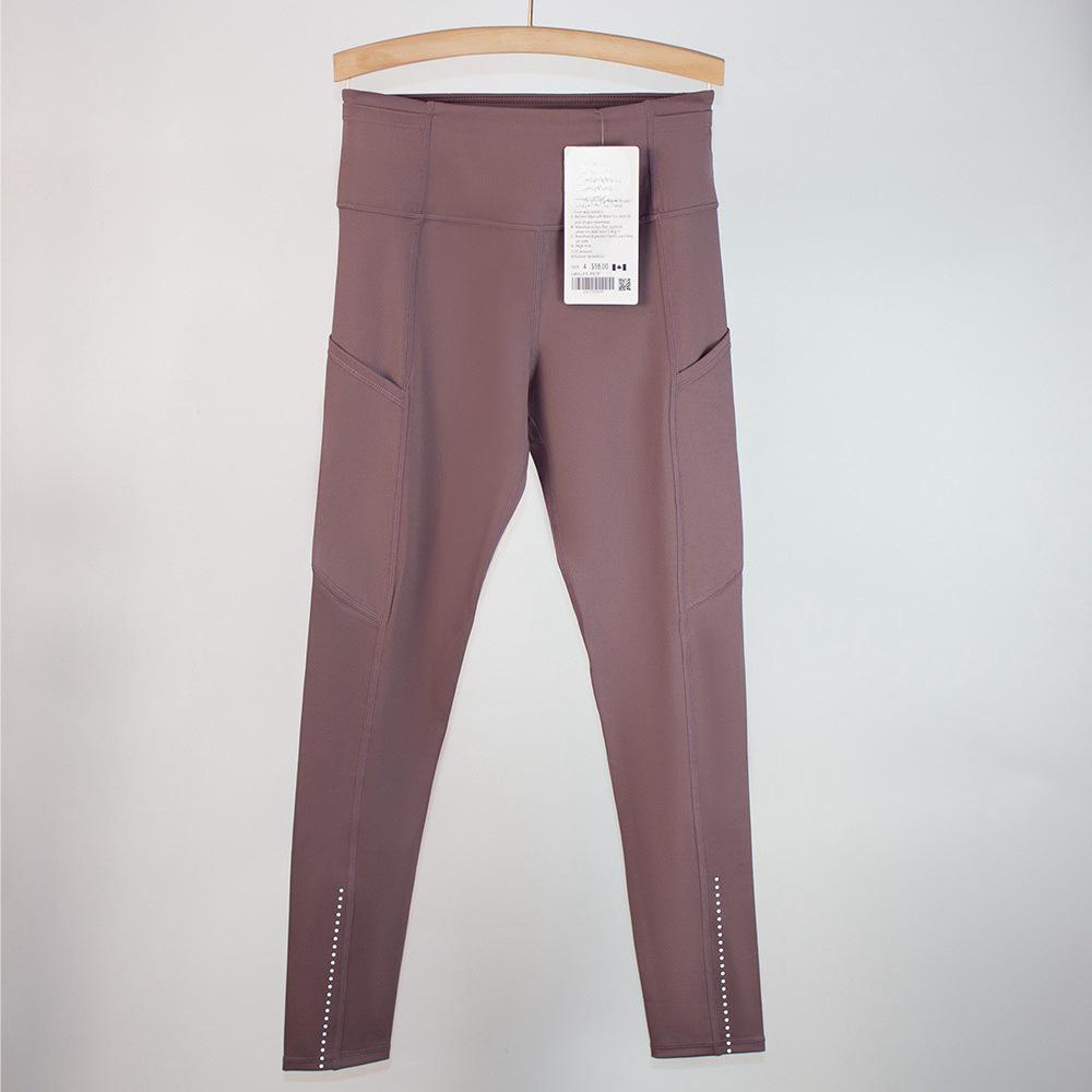 Women's High Waist Tummy Control Yoga Pants with Pockets - Tight Fit for Running, Cycling, and Outdoor Activities.