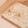 Flower earrings exaggerated design earrings women's electroplated alloy versatile hollow line woven stud earrings