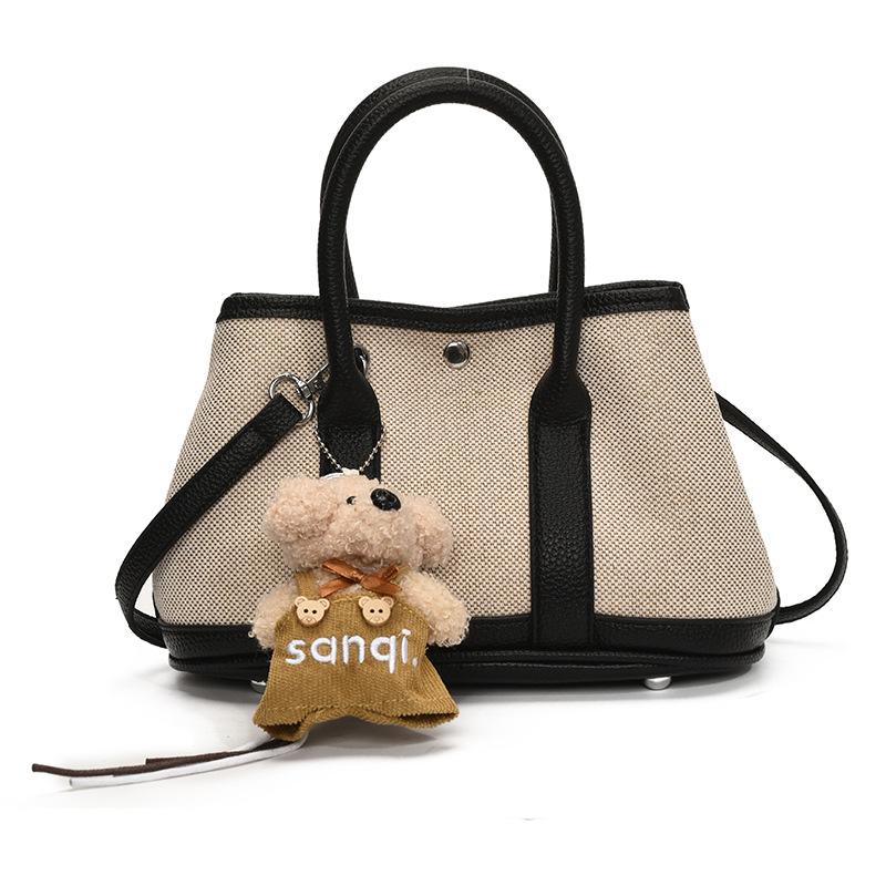 Korean version of casual niche contrasting color splicing portable bucket bag fashion versatile temperament casual commuter messenger bag woman