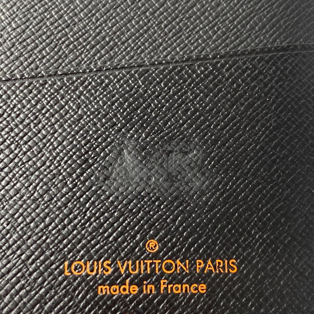 Używany portfel LOUIS VUITTON Seria Brązowo/Pomarańczowa PVC męski