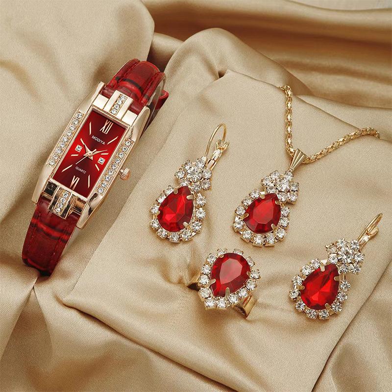 Vintage Schmuckset mit grünen Edelsteinen: Uhr, Halskette, Ohrringe und Ring