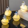 Astronaut Night Light Planet Lamp: Luminous Moon Ornament for Bedroom Decor, Gift, or Souvenir with Silk Flower.