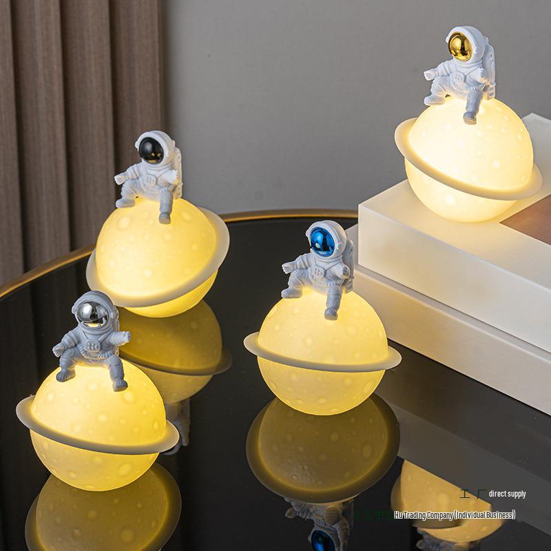 Astronaut Night Light Planet Lamp: Luminous Moon Ornament for Bedroom Decor, Gift, or Souvenir with Silk Flower.