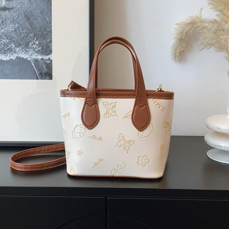 

Сегодняшняя популярная женская сумка-ведро большой вместимости с новой весенней текстурой, портативная на плечо, с тиснением в виде бабочек, для поездок на работу