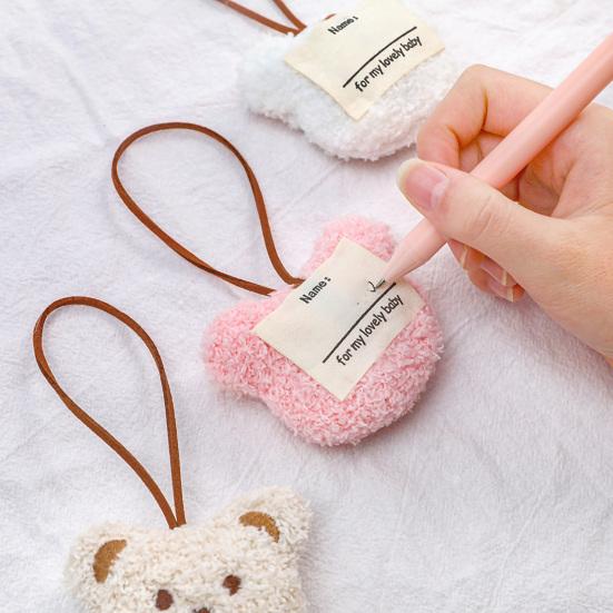 Precioso llavero con decoración de oso y cabeza con tacto acogedor