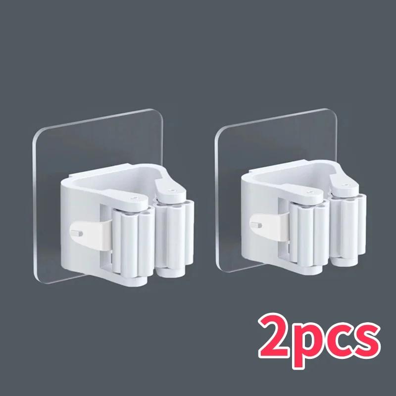 

Настенный пластиковый подвесной стеллаж для хранения швабр, самоклеящийся держатель для швабр, крючок-клипса без сверления, экономящий место для хранения швабр и метел