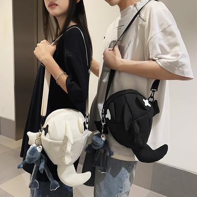 Borsa a tracolla da uomo con motivo squalo e borsa a tracolla da donna con motivo cartoon