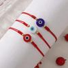 Evil Eye Multicolor String Bracelet: Fashionable Hand Jewelry for Daily Wear and Personal Style.