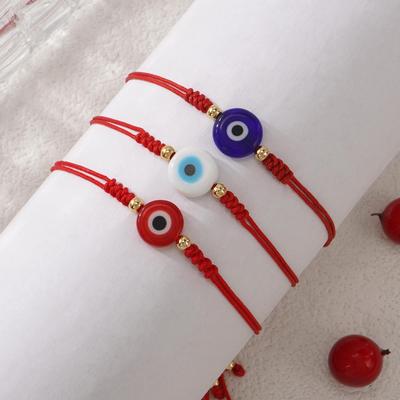 Evil Eye Multicolor String Bracelet: Fashionable Hand Jewelry for Daily Wear and Personal Style.