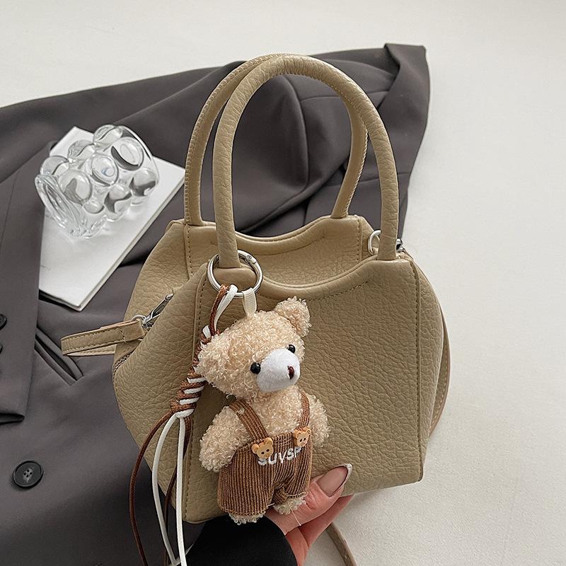 Wholesale fashion high sense simple style solid color lychee pattern bucket bag casual versatile commuter messenger women's bag