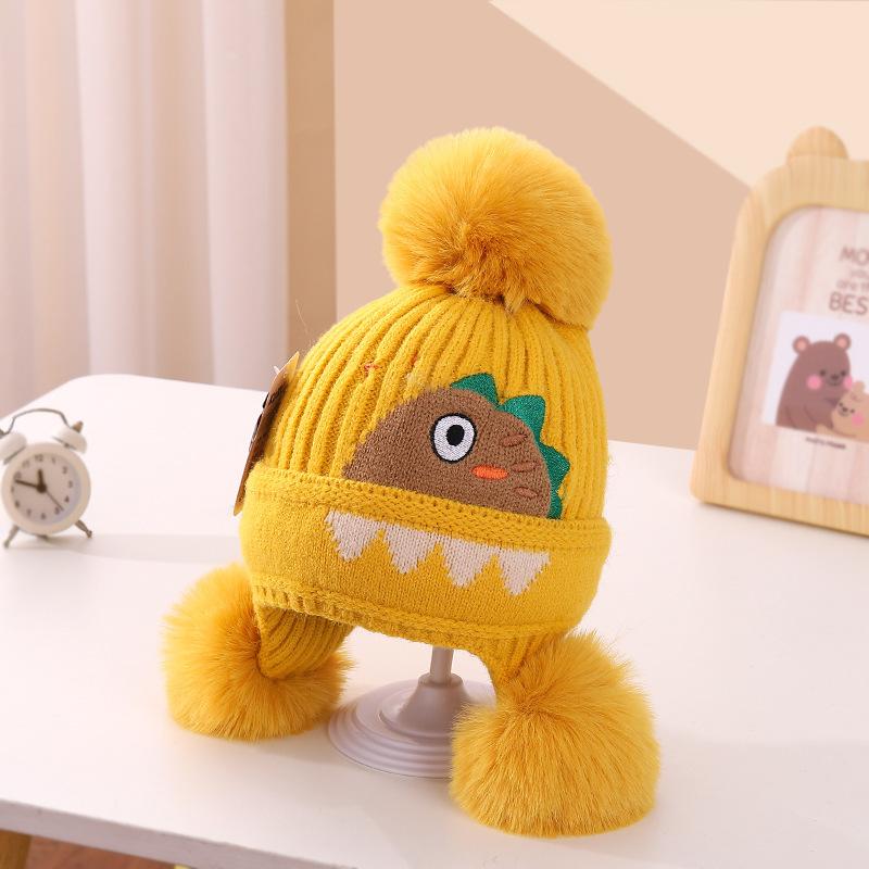 A children's dinosaur wool hat winter new cartoon jacquard knitted hat medium and older boys and girls ear hats