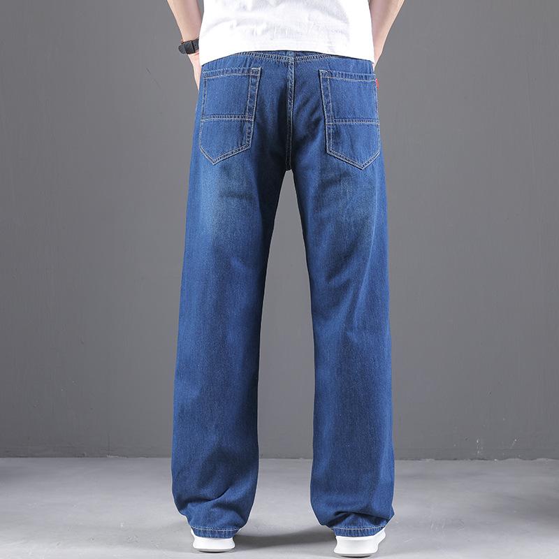 Premium men's denim trousers: relaxed straight-leg, lightweight summer style with no stretch, wide-leg cut, plus sizes available.