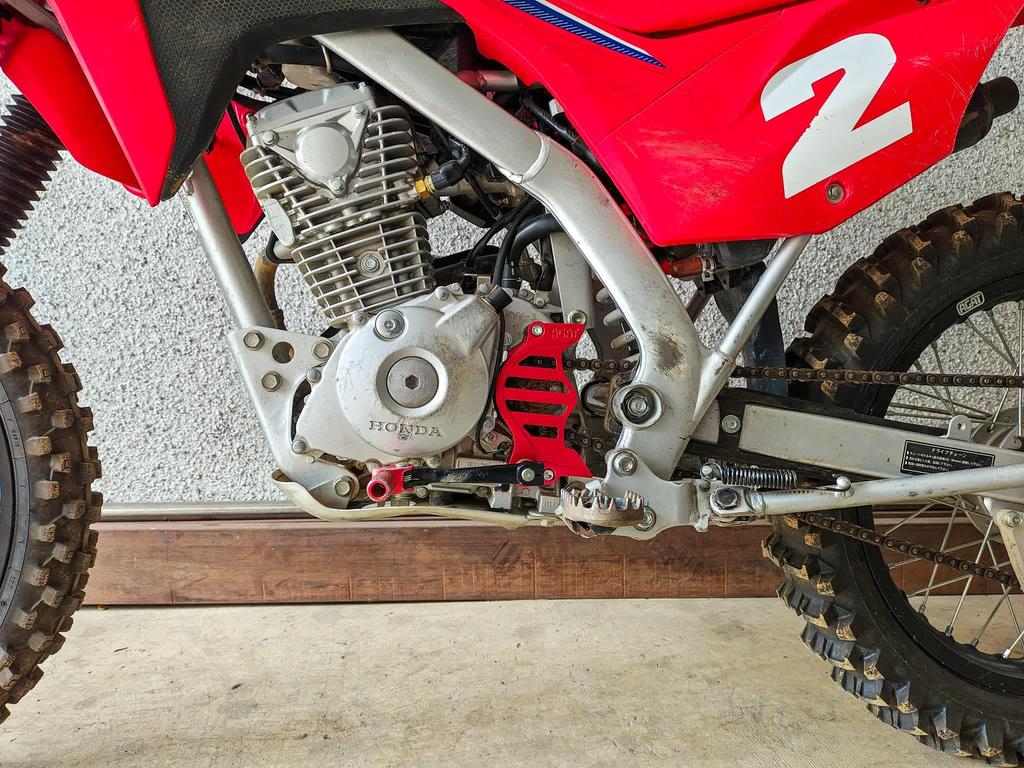 CRF125F Shift Shaft Support & Sprocket Guard (Red)