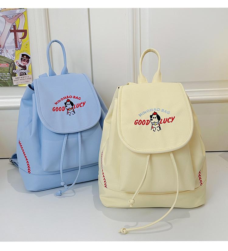 Japanese Student Casual Backpack with Embroidered Puppy Design, Drawstring Closure, and Matching Small Bag for Daily Use.