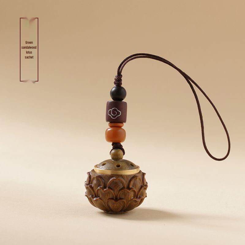 Green Sandalwood Hollow Mobile Phone Chain: Exquisite Aromatherapy Sachet Ball and Tibetan Incense Pendant Keychain in Ancient Style.