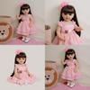 Bambola Reborn Completamente in Silicone con Vestito Rosa e Decorazione Floreale per il Compleanno dei Bambini