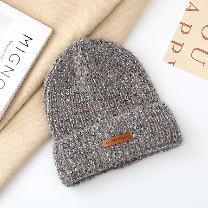 Autumn and winter pullover warm wool hat women's fashion leather label knitted confinement hat outdoor cycling sports hat