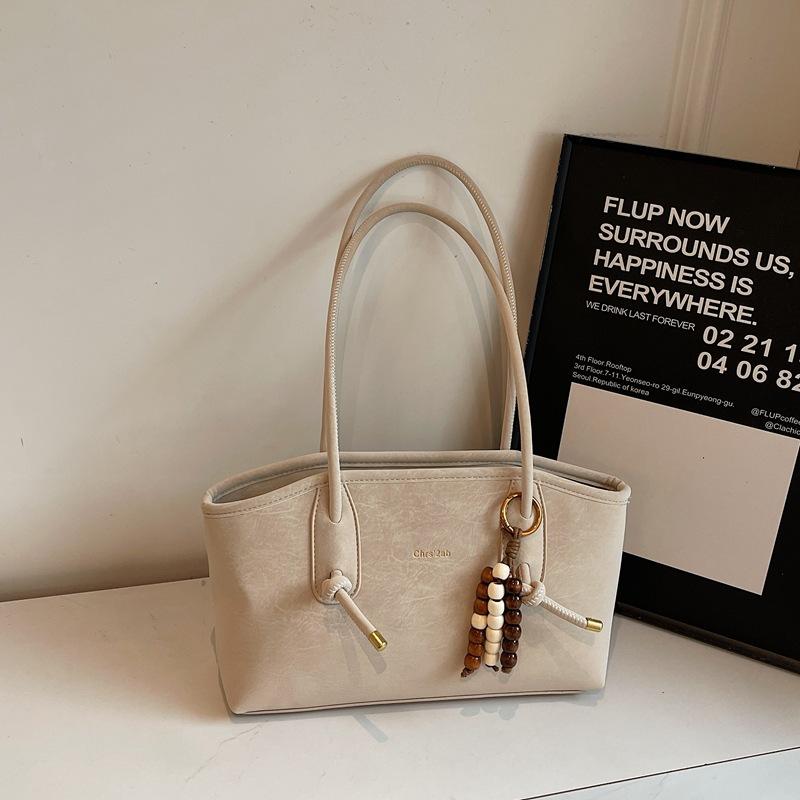 

Retro niche texture underarm bag women s 2025 new simple portable commuter tote bag large capacity shoulder bag