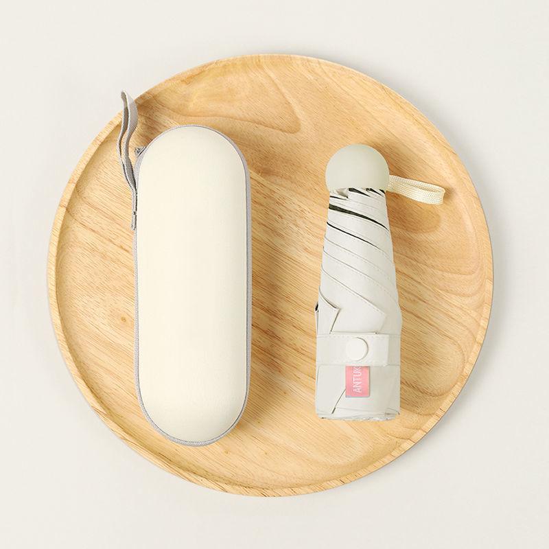 Parasol Capsule Sun Umbrella: 50% Off Mini UV Protection for Women, Dual-Purpose for Sun and Rain.