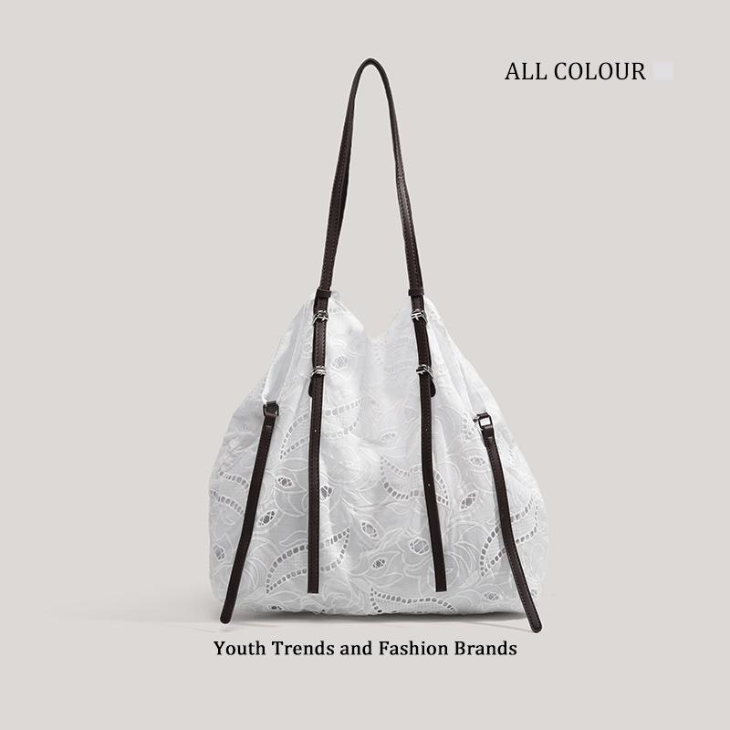 

2025 summer new niche design tote bag fashionable simple high value hollow commuter shoulder armpit bag белый