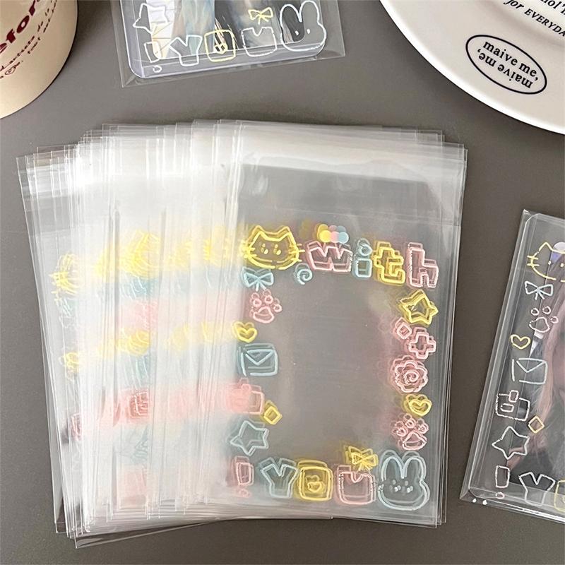 100 Stück Cartoon Graffiti Kätzchen Selbstklebende Beutel Süßigkeiten Lebensmittelverpackung Karte Geschenktüte Kleiner Selbstverschließender Beutel Transparenter OPP-Beutel