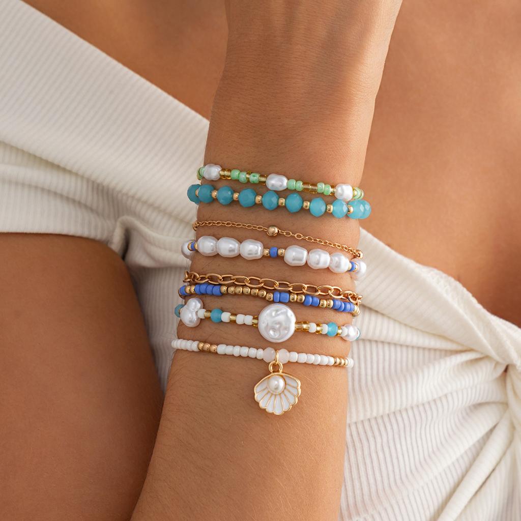8-teiliges Set Boho Perlen-Stapelarmband-Set für Damen Meeresmuschel Perlen-Anhänger Mehrschichtig Blaue Rocailles Strandurlaub Schmuck