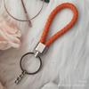Gevlochten Lederen Touw Sleutelhanger met Poppenhanger - Modieus en Creatief Accessoire