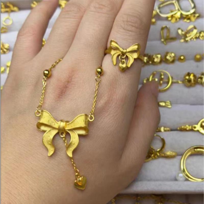 

Gold-Plated Princess Necklace and Earrings Set: Bowknot Heart Tassel Pendant with Collarbone Chain.