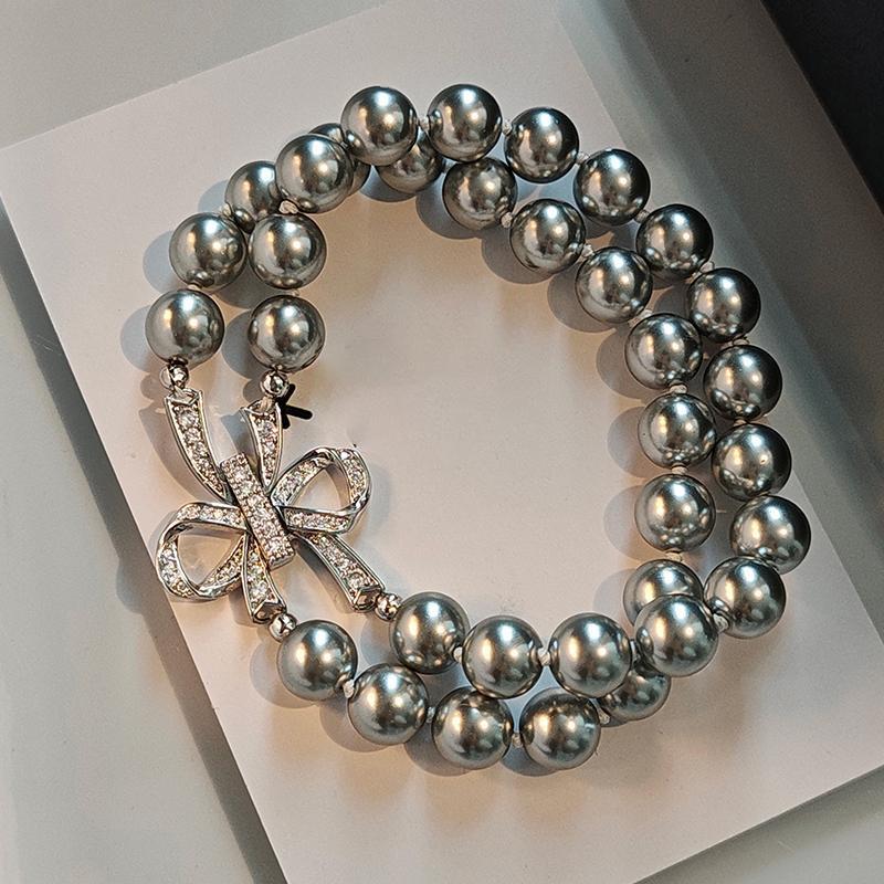 

Браслет-бант из двух слоев искусственного жемчуга, модный, легкая роскошь, нишевый браслет, ювелирное изделие с ощущением высокого класса, женский