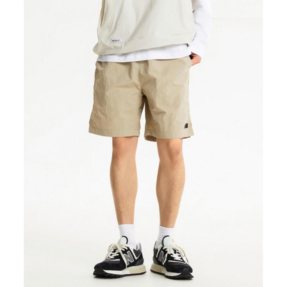 

New Balance Nbnve21023 Uni Ess Heritage Woven 4.5 шорты бежевые