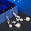 Trendy Korean & Japanese Pearl Tassel Earrings: Elegant, Long Rhinestone Dangles, Fashionable Celebrity Style for Women.