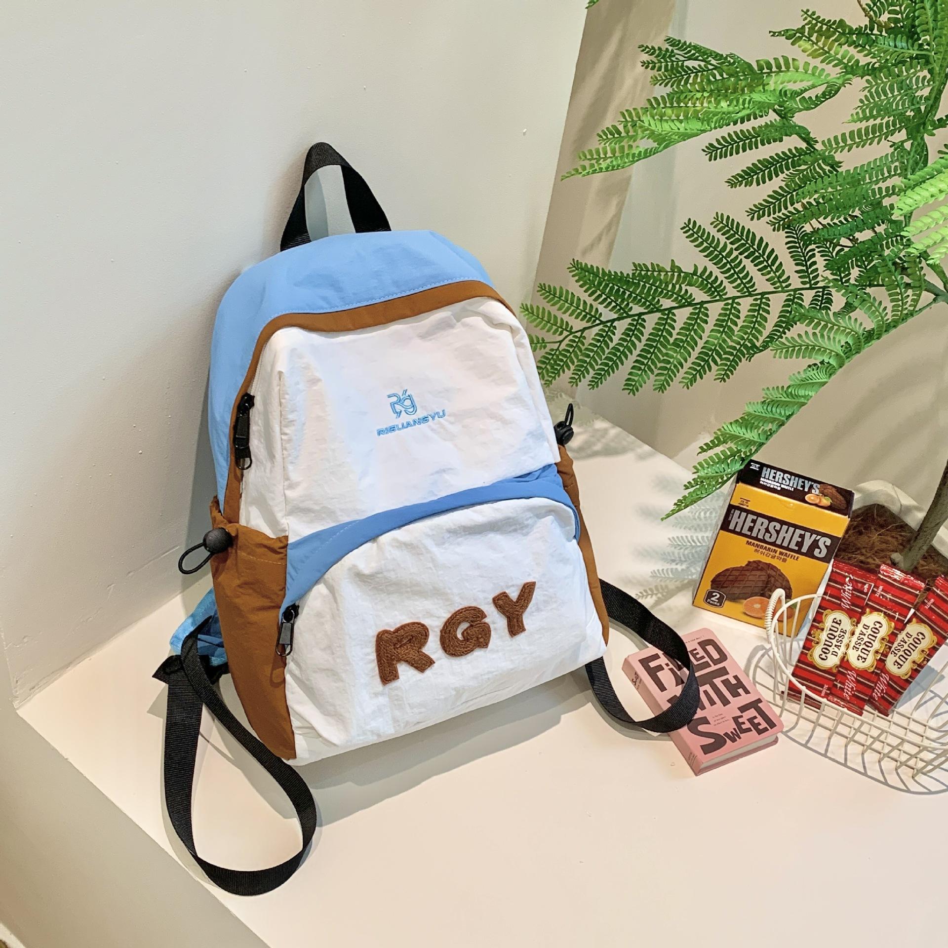 

2024 autumn new large-capacity campus wind contrast color double shoulder travel trend backpack student backpack синій